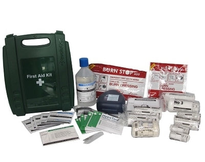 First aid kit with various supplies on a white background