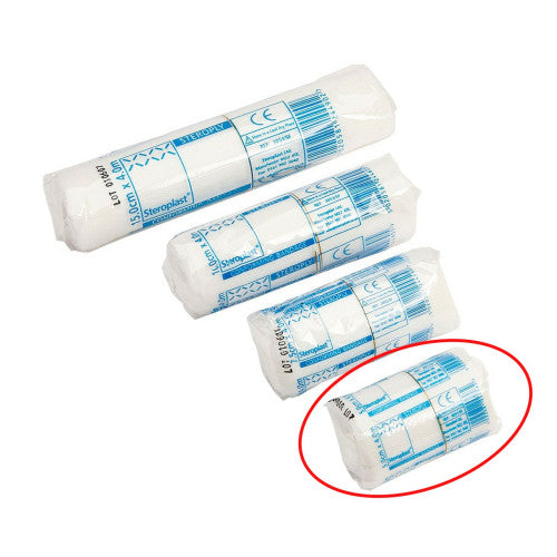 Rolls of individually packaged white bandages with blue printed text and barcodes
