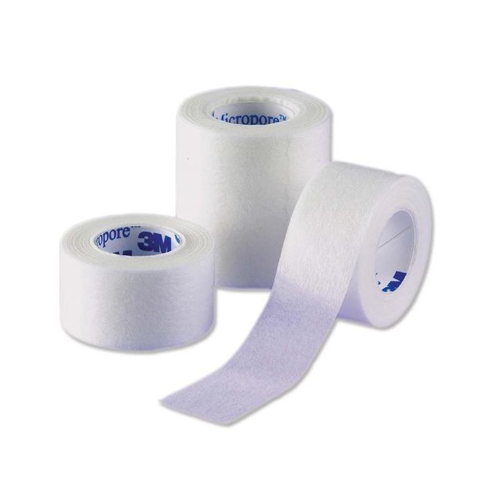 Three rolls of medical tape on a white background